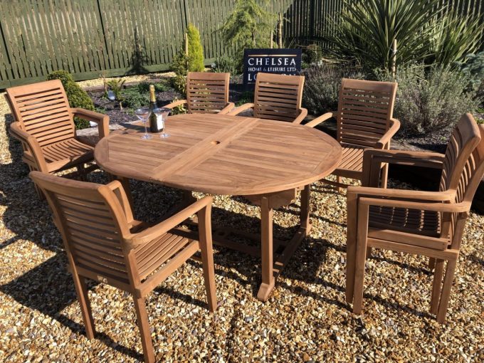 Teak extending table with 8 stacking chairs
